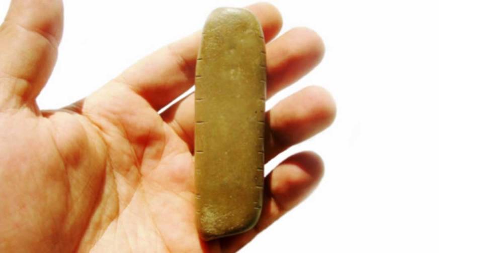  The old pebble was carved by Stone Age humans – possibly to track lunar cycles