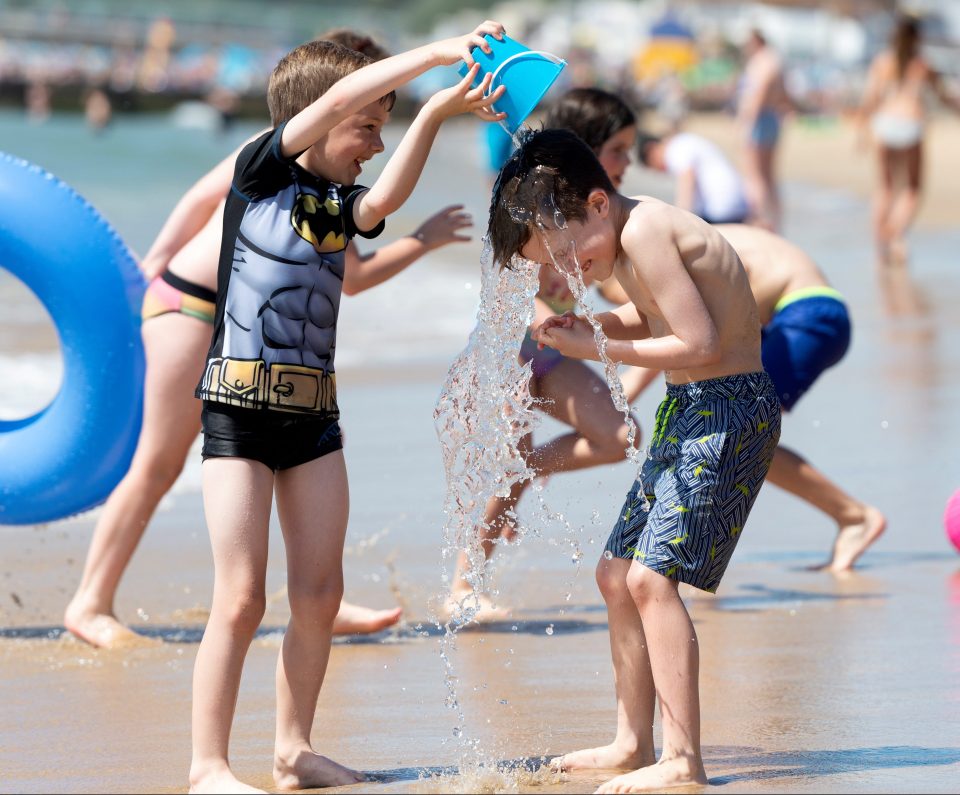  The heatwave continues as people flock to Bournemouth beach to enjoy the heat