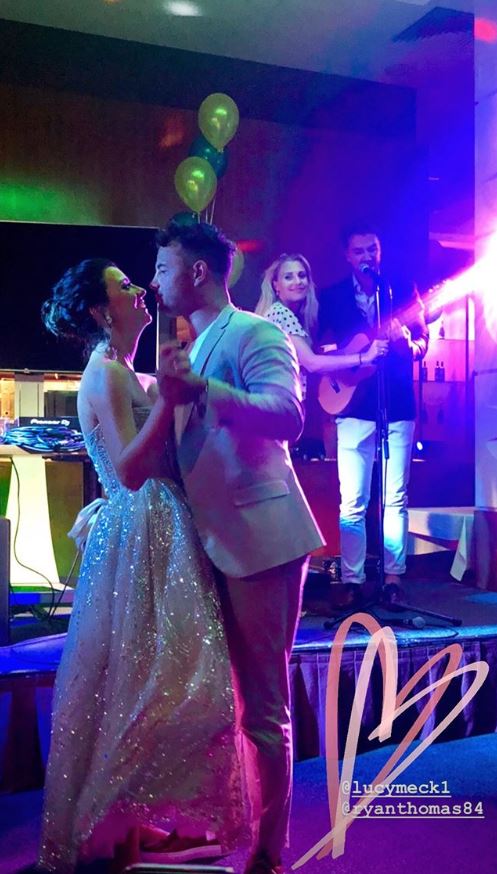  A two-piece band sang a romantic song for the bride and groom to be