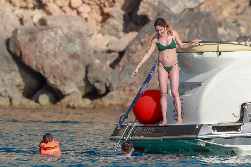  His wife Ayda and their pals watched from the boat as Robbie went for a swim