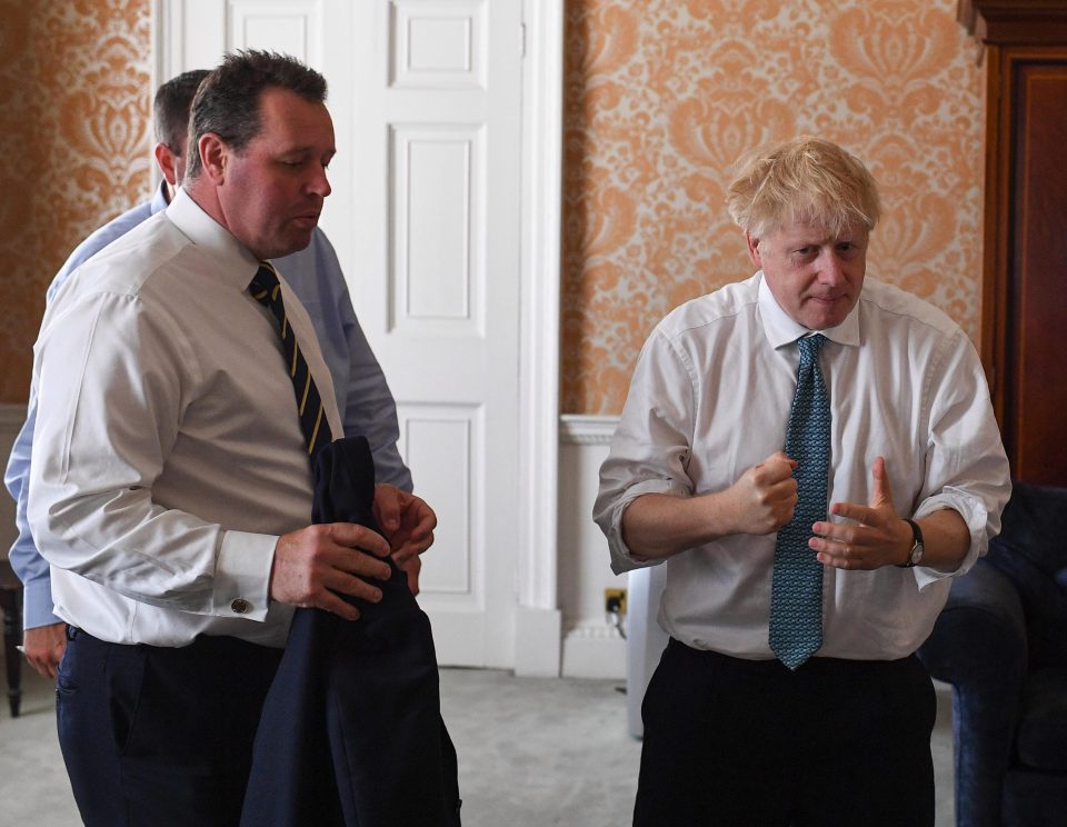 Bojo with Will Walden and Mark Spencer, forming his new cabinet on a white board 