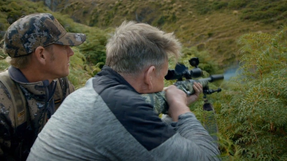  The Scot is shown taking aim at the goat in New Zealand's South Island