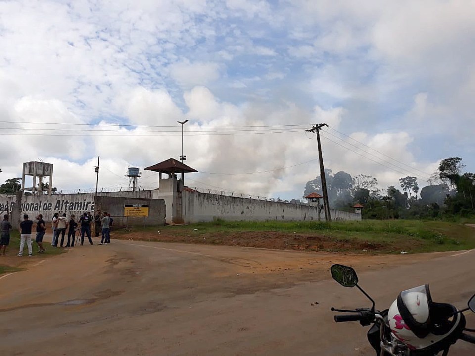  Smoke billowed above the stricken jail where inmates were burned alive