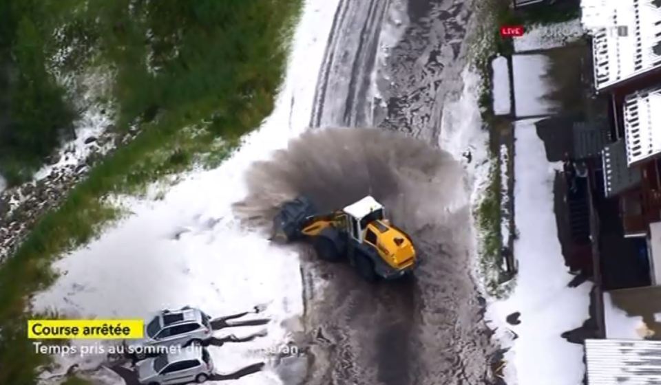  Snow and mud were seen being pushed off the side of the road