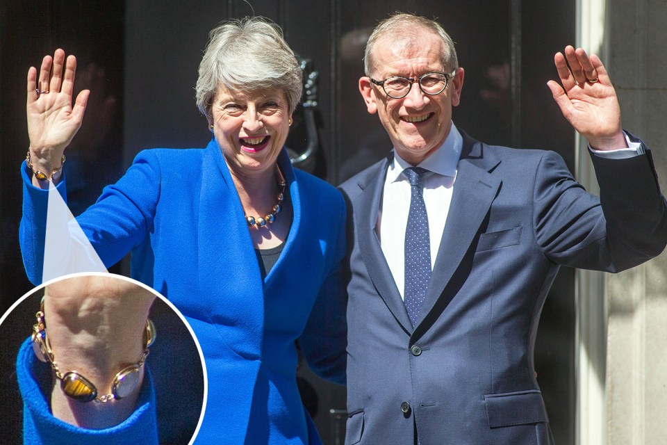 Mrs May was spotted wearing 'the bracelet' outside No.10 yesterday with husband Philip