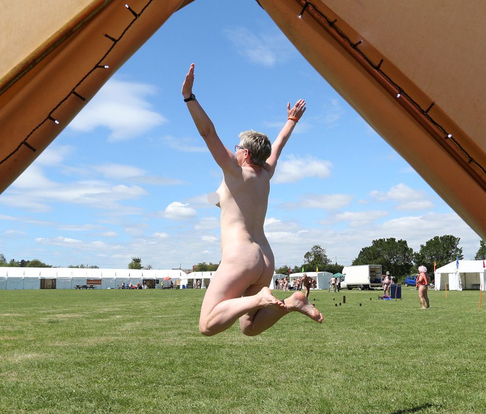  A festival goer jumps in celebration