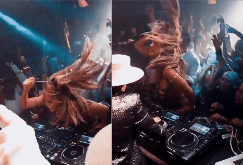  Jennifer whipped her hair around as she took over the decks