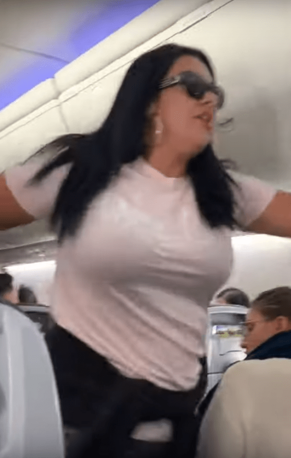 The aggressive woman stormed about swearing