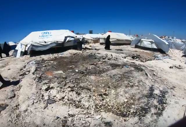  The charred remains of two tents can be seen in the video from inside the Al-Hawl refugee camp