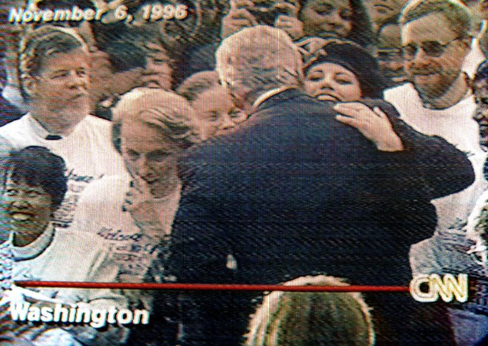  Bill Clinton, with back to camera, hugs Monica Lewinsky in 1996