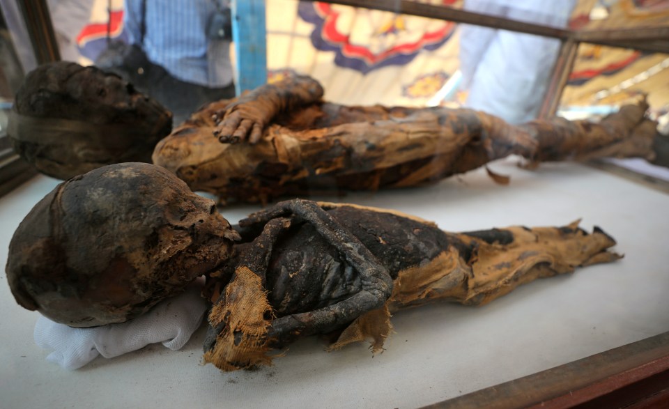  Two mummies of a woman and a child are currently also on display at the site in Sohag