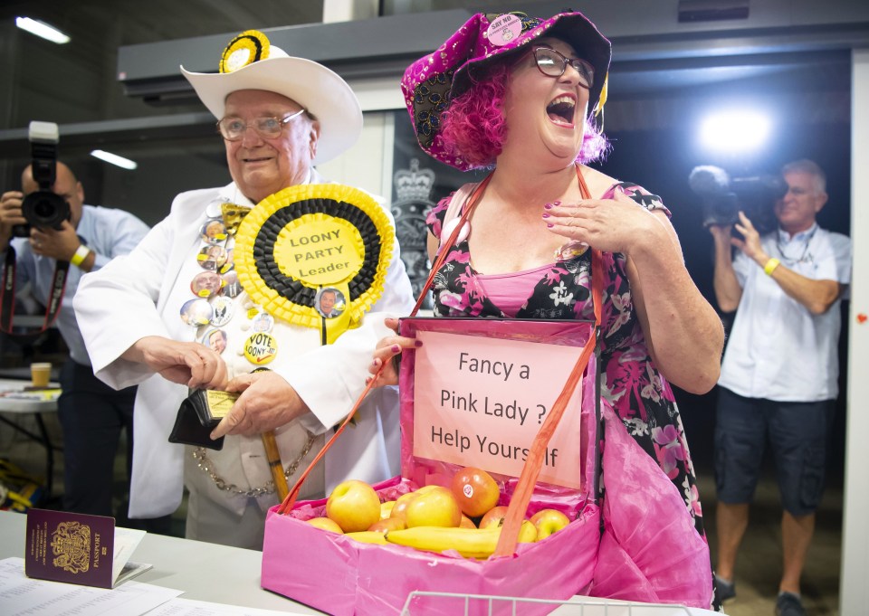 The Official Monster Raving Loony Party candidate Lady Lily The Pink, right, entering the counting hall before her party’s fifth place finish – beating UKIP