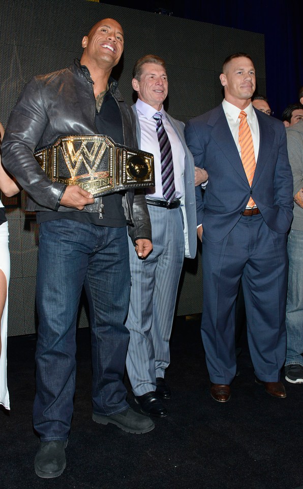 The Rock (left) did return to work for Vince McMahon (centre) and battle John Cena (right) in 2012 and 2013