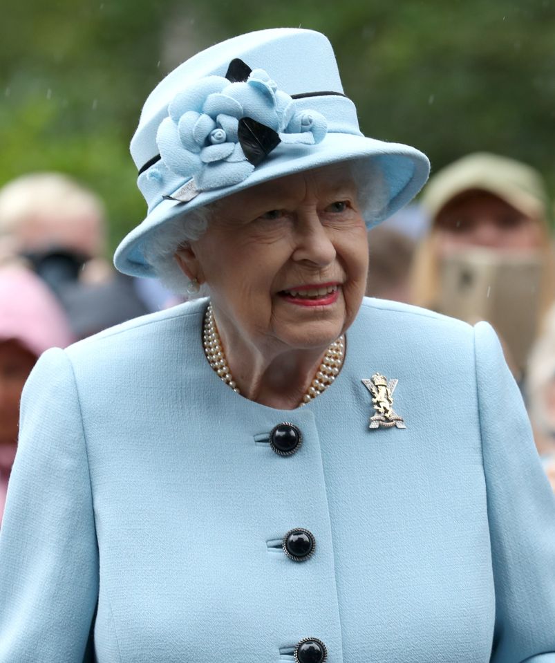 The Queen wore a baby blue outfit with a matching hat for her day out in Balmoral