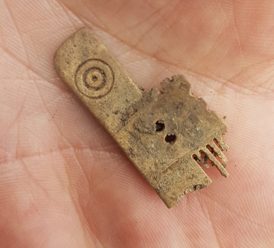  This piece of a bone comb was found at the site