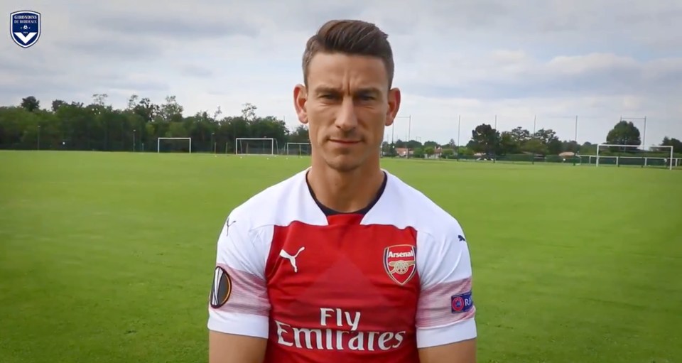  Laurent Koscielny poses with the Arsenal shirt on - something Gooners are pretty glad he no longer wears