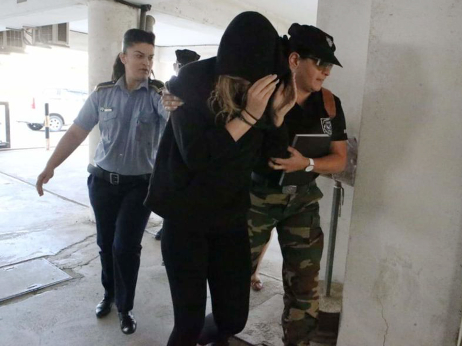  British woman, 19, led into court after being arrested on suspicion of filing a false complaint of gang rape for which a dozen Israeli teens were held, Cyprus police say