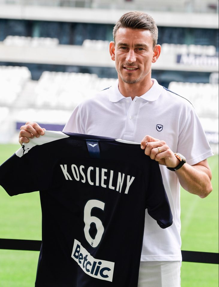  Former Arsenal defender Koscielny poses with his new jersey