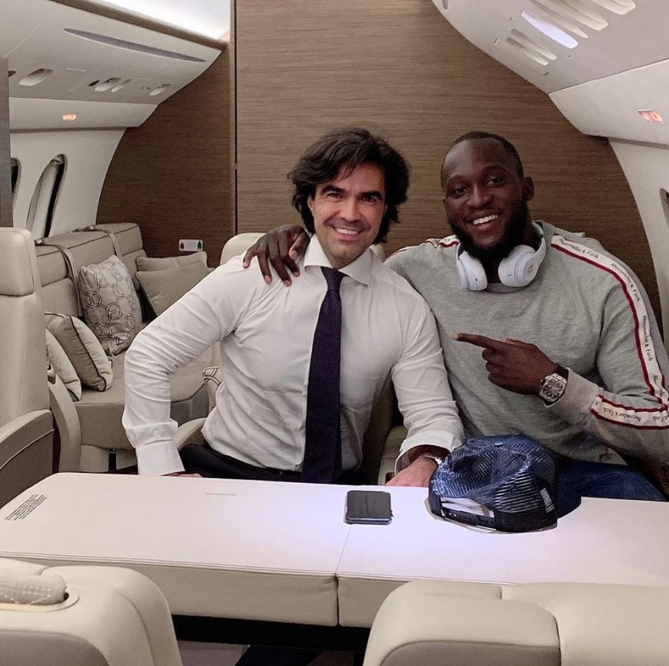  Romelu Lukaku, pictured with his agent, is clearly delighted with his Italian job