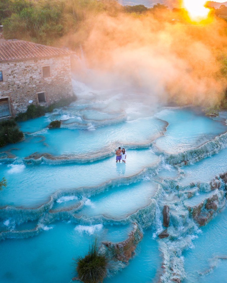  Two people take a morning bath in Tuscany as the sun comes up