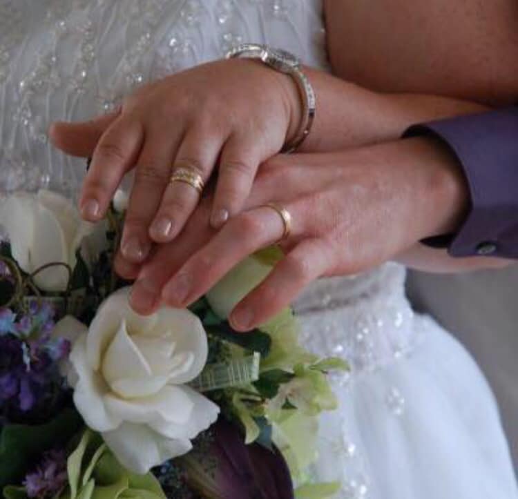 The bride proudly displayed her ill-fitting ring