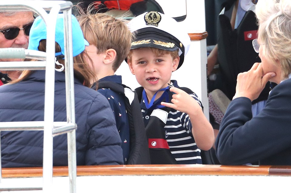  Prince George, six, cheered on his parents in the race today