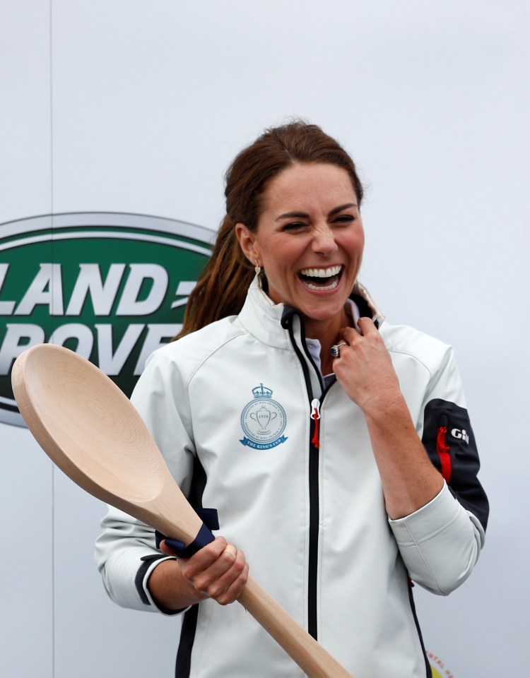 The duchess grins as she holds up the spoon