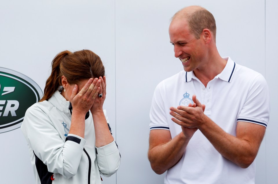 Kate put her head in her hands after losing the race, while husband Prince William clapped