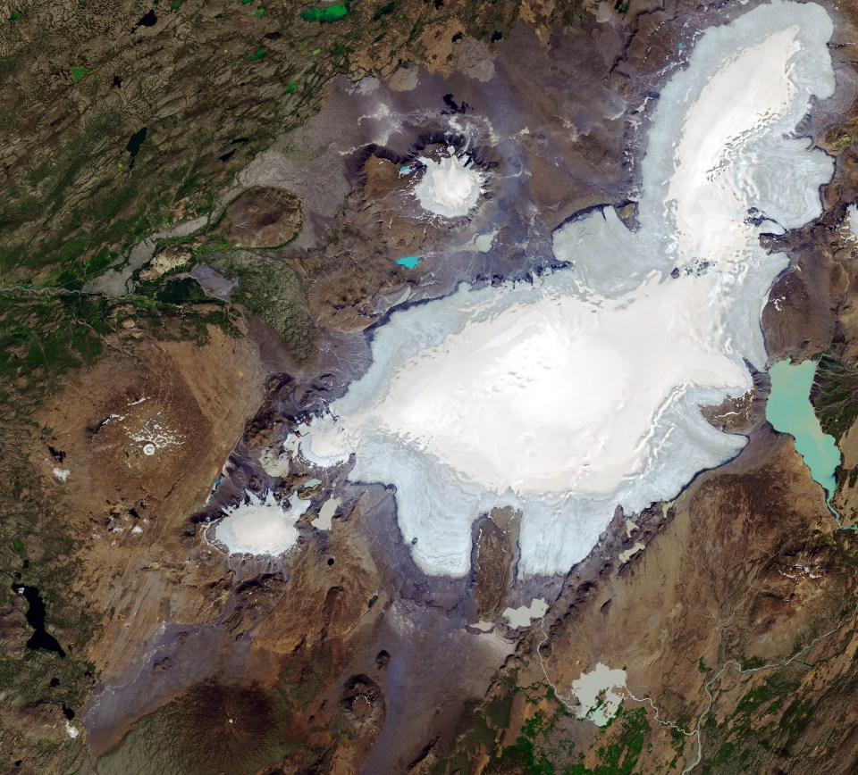  A 2019 image released by Nasa shows the disappearance of the Ok glacier, and the significant reduction in the size a nearby glacier, now surrounded by blue meltwater after the 2019 heatwave