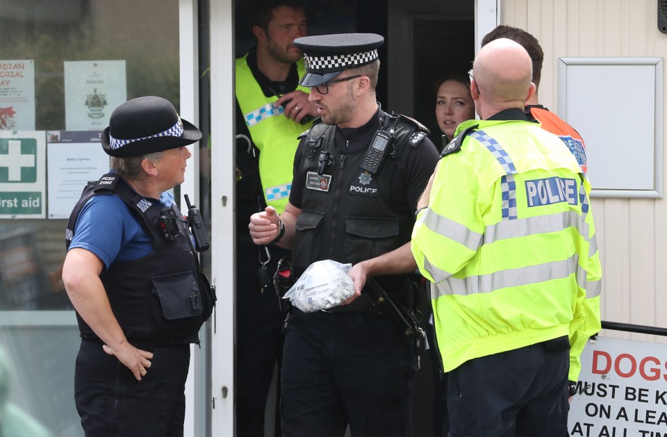  Officers set up a cordon in Worthing, West Sussex, today