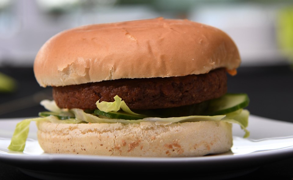  The burger is served in a vegan brioche bun on a bed of cos lettuce and onion relish