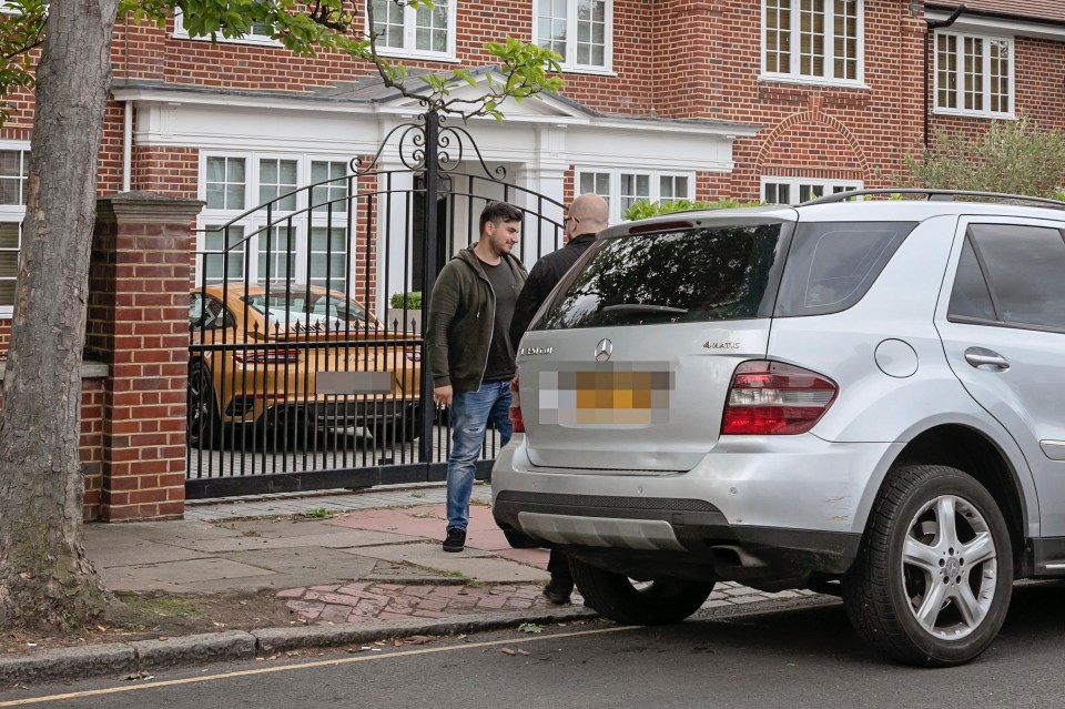  Security were seen outside the London home of Arsenal star Mesut Ozil today