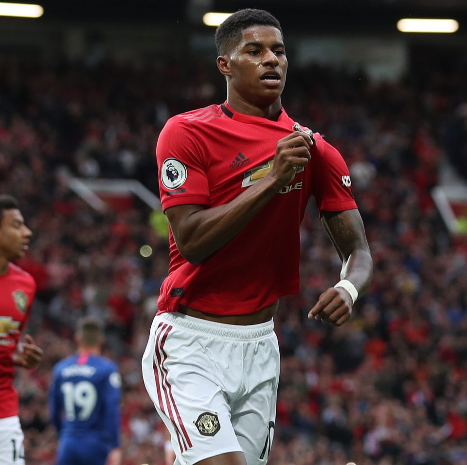 England striker Marcus Rashford rejoices after his spot-kick opener in a tricky first game for Man Utd