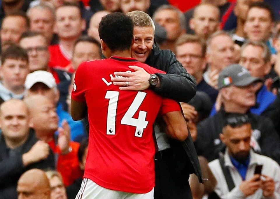 Old Trafford chief Ole Gunnar Solskjaer celebrates victory with midfielder Jesse Lingard