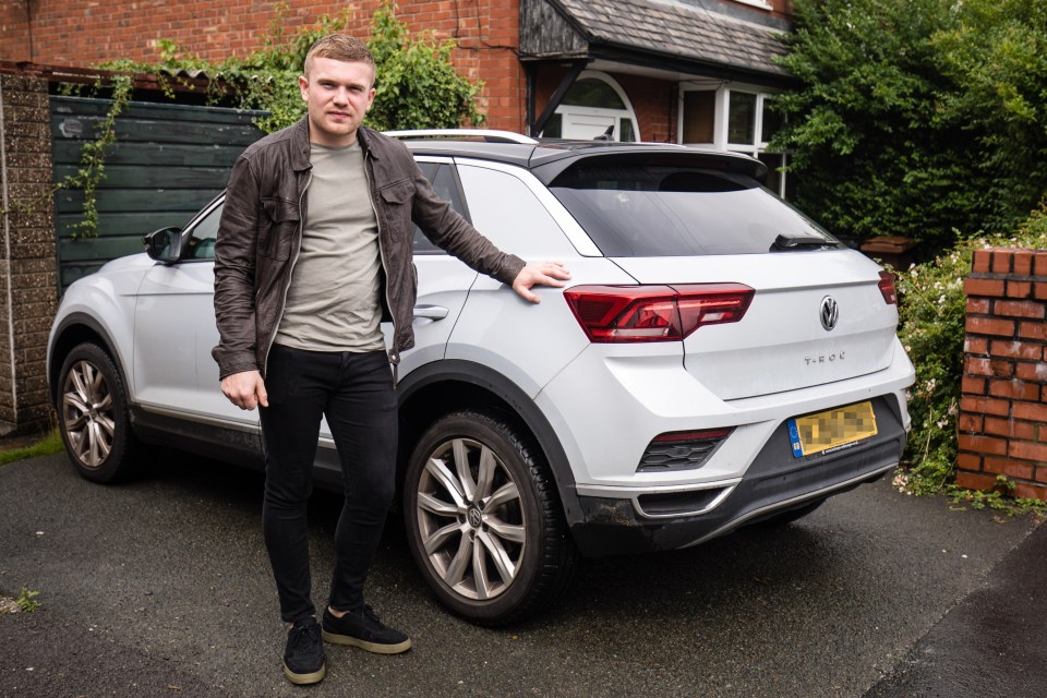 Mr Eames standing with the car he was attacked in last week