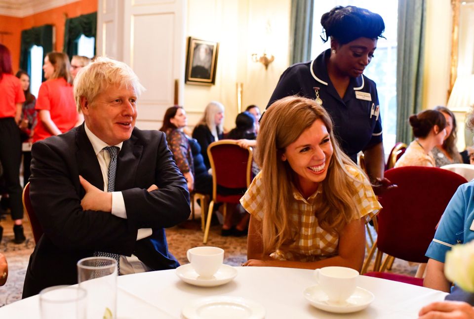  Carrie Symonds wore a £159 Whistles dress to host a reception for hospice workers with PM Boris Johnson on Monday