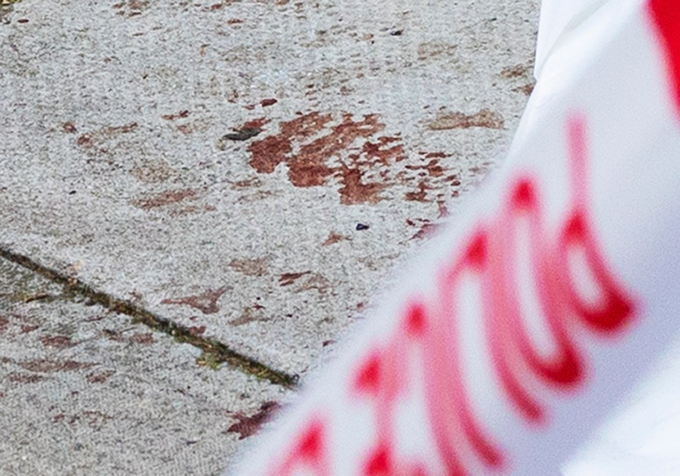  Blood could be seen in the pavement where a 16-year-old boy was knifed to death last night