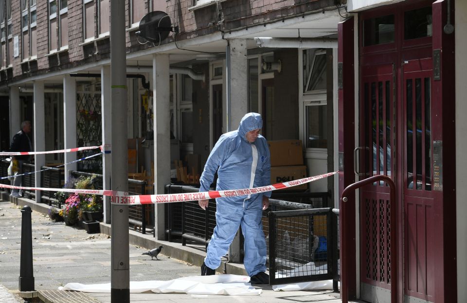  A forensic officer at the scene in Munster Square, Camden