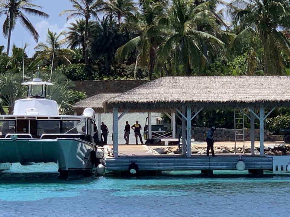  FBI officers can be seen arriving by speedboat at Jeffrey Epstein's 'paedo island' in Ausguat