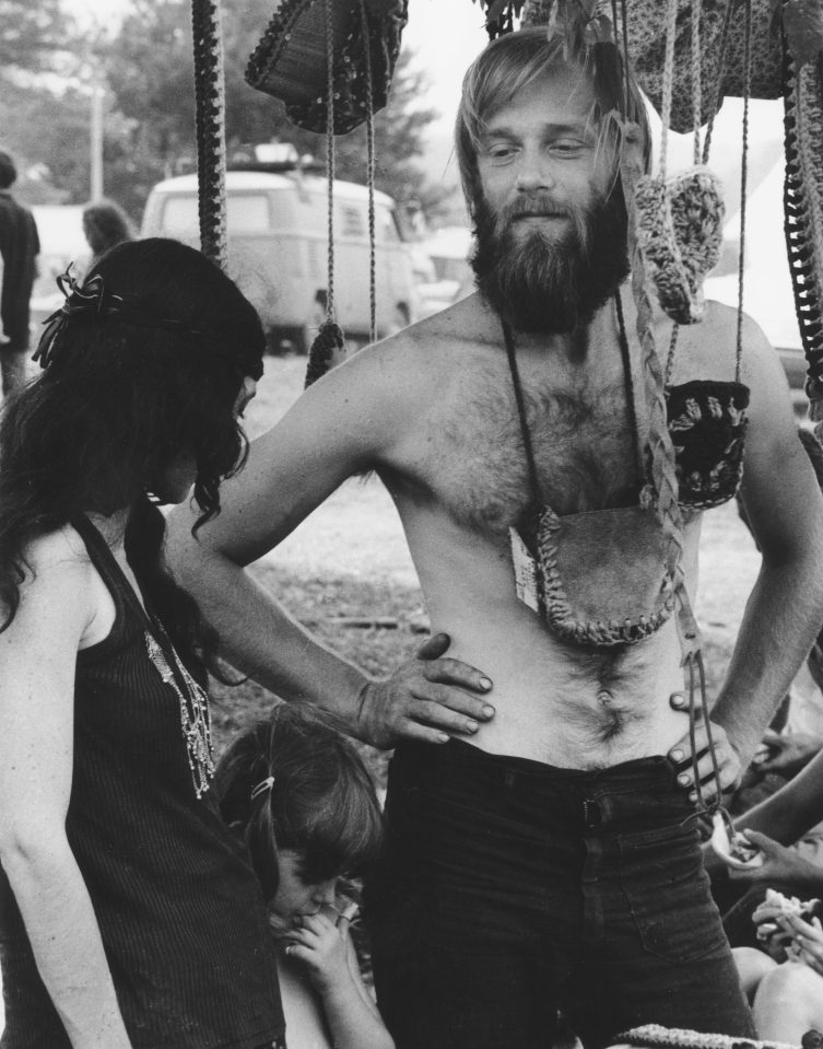  A hippie couple with their child at the iconic event - the pivotal festival of 'peace and music' 50 years ago remains an inspiring moment of counterculture community and youthful freethinking