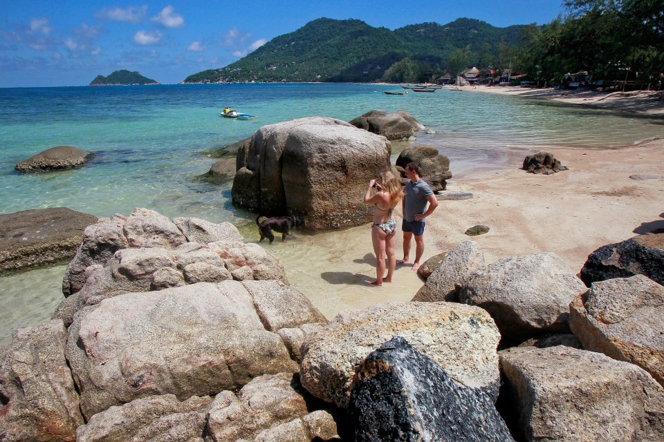  Tourists take pictures on the island of Koh Tao, Thailand,