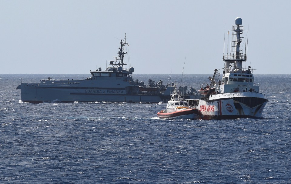  A police boat and a coast guard boat are seen patrolling near the Spanish migrant rescue ship Open Arms, close to the Italian shore in Lampedusa