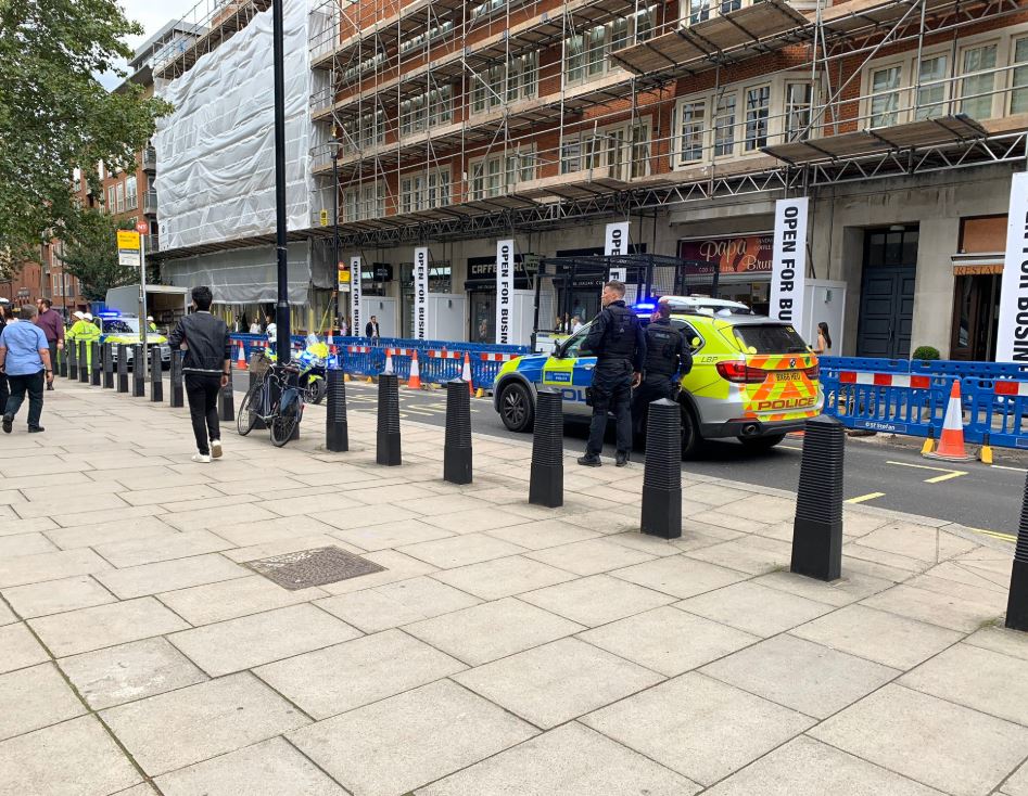 Police were seen outside the Home Office in London today