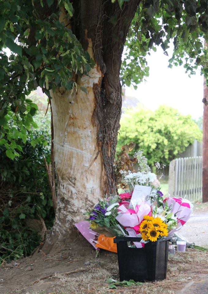  Flower tributes and sympathy cards have been laid at the scene