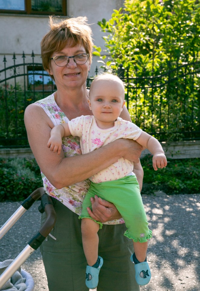  Malgorzata Blacha, 61 and Isabella, 11 months, in the village of the dames