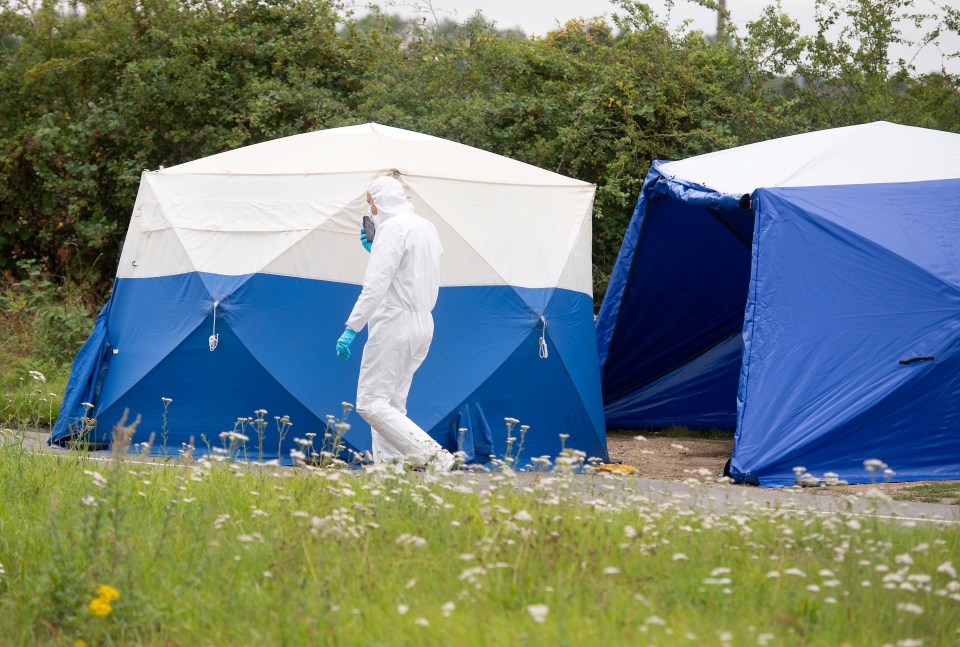 Officers at the scene of the incident, which is cordoned off while evidence is gathered