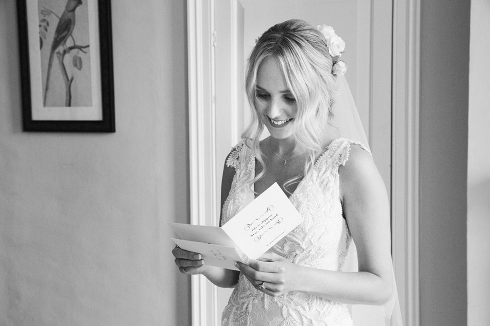 Bride Lissie reads the touching message from husband Andrew on their wedding day