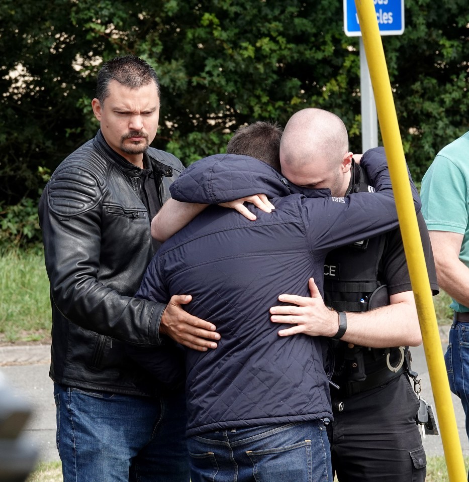 Distraught mourners, including officers from Thames Valley Roads Policing unit, were among those grieving PC Harper