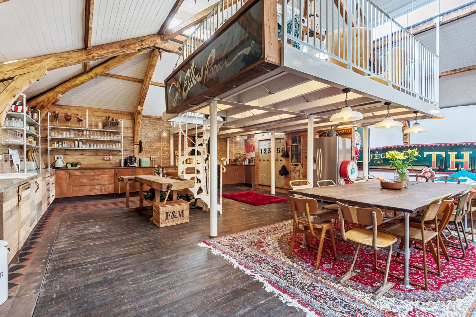  A gorgeous spiral staircase leads up from the kitchen to the mezzanine