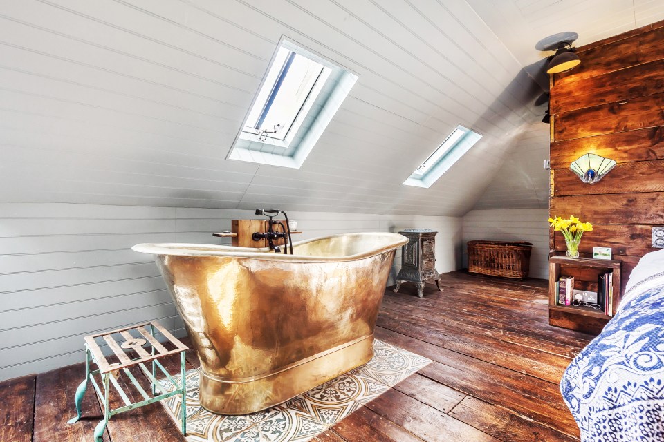  This stunning nickel bath is a central feature in the enormous master suite.